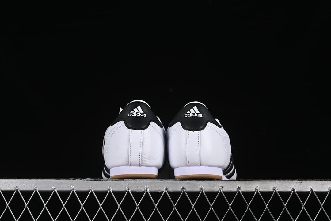 Rear view showing black heel panels and gum-colored outsole edges.