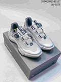 Pair of silver-gray Kailas FUGA shoes with BOA dial closures displayed on a FUGA box.