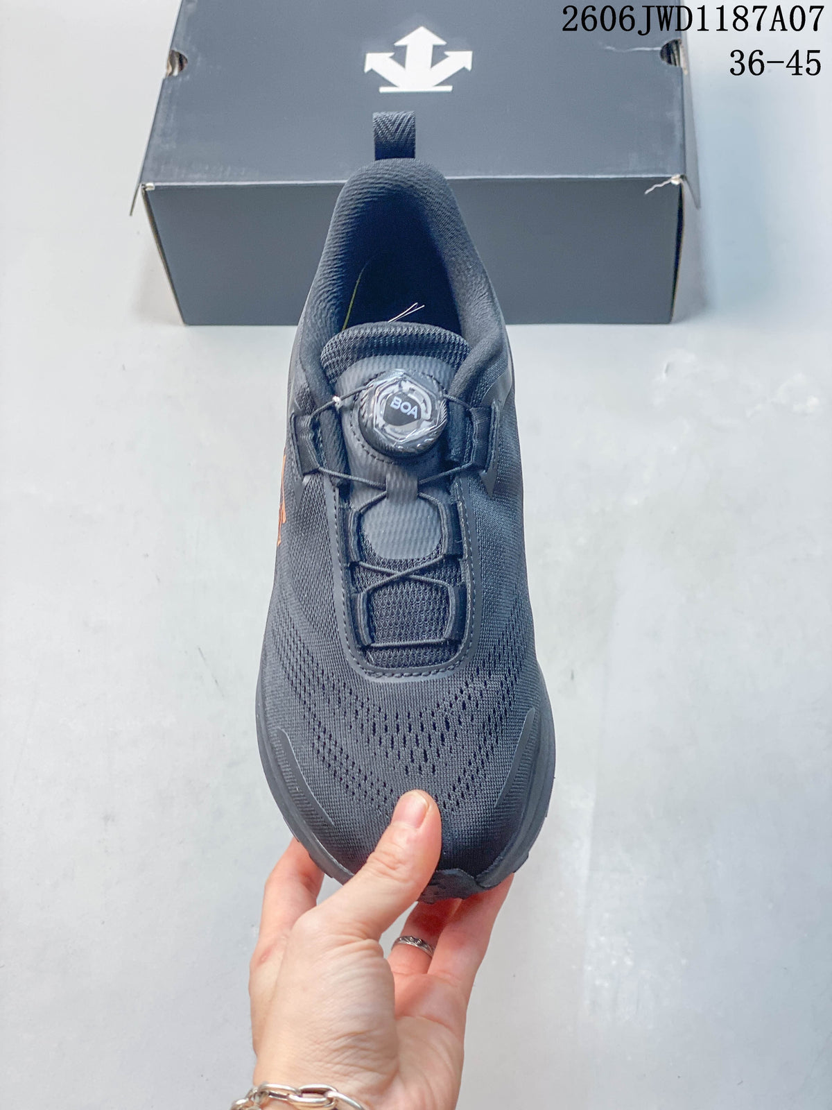 Top view of a dark gray sneaker showing its dial-based closure and mesh-style upper.