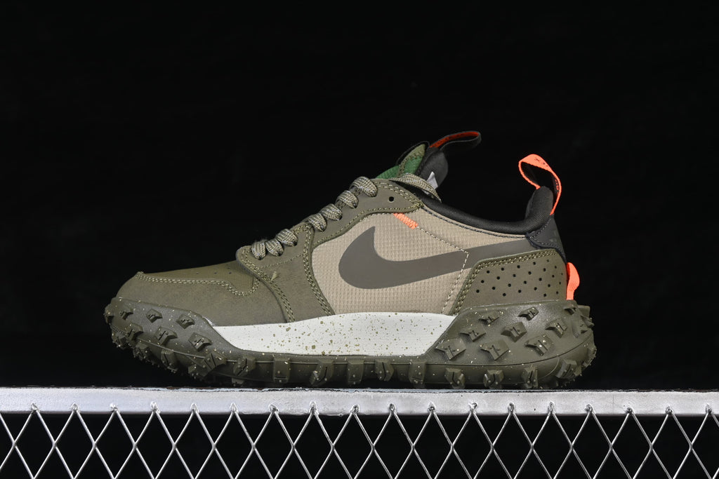 Side profile showing the gray Swoosh, olive panels, speckled midsole, and lugged outsole.