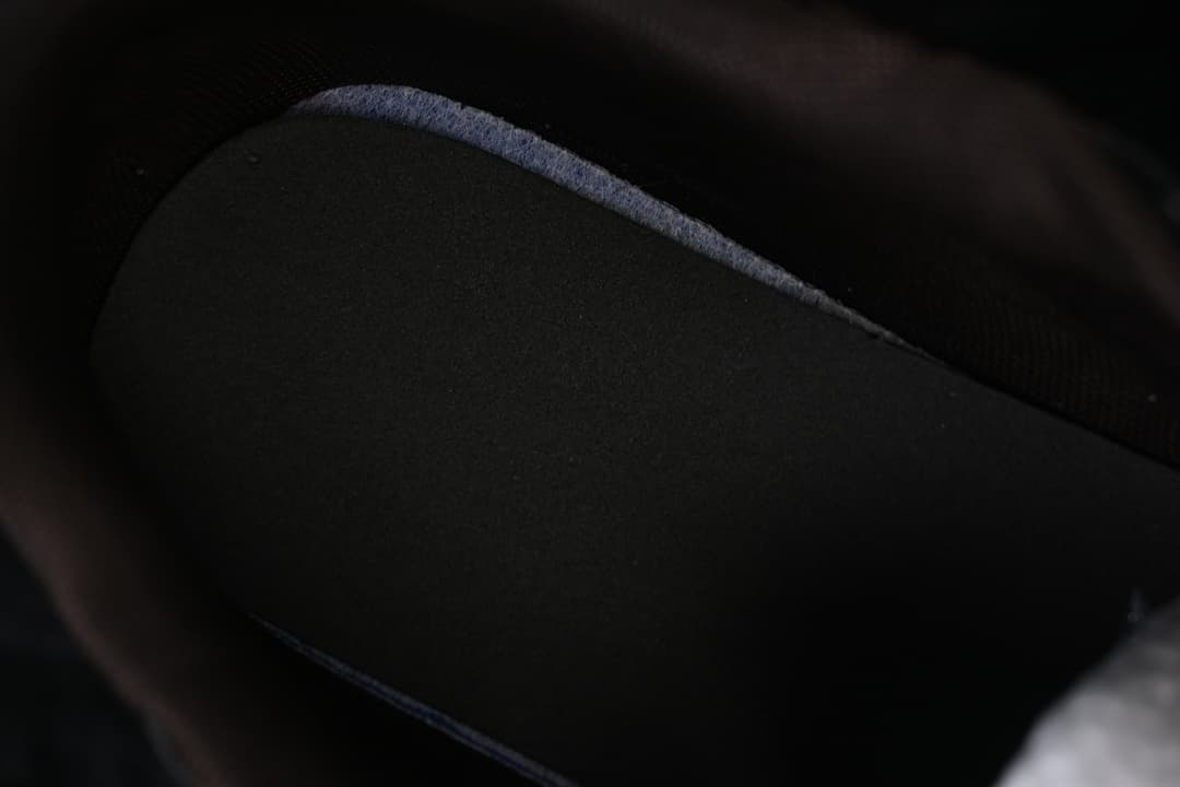 Close-up view inside the sneaker, showing its dark interior.