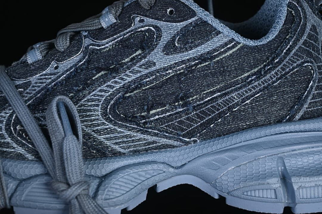 Close-up of denim-look side panels and layered outsole