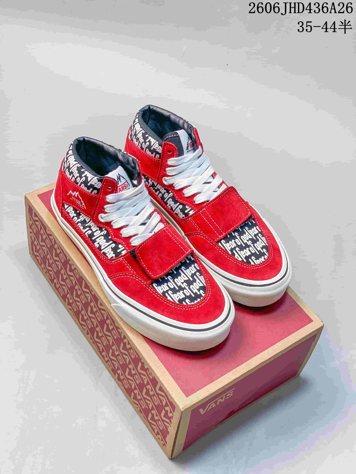 Pair of bright red sneakers with Fear of God name print, white laces and an additional forefoot strap.