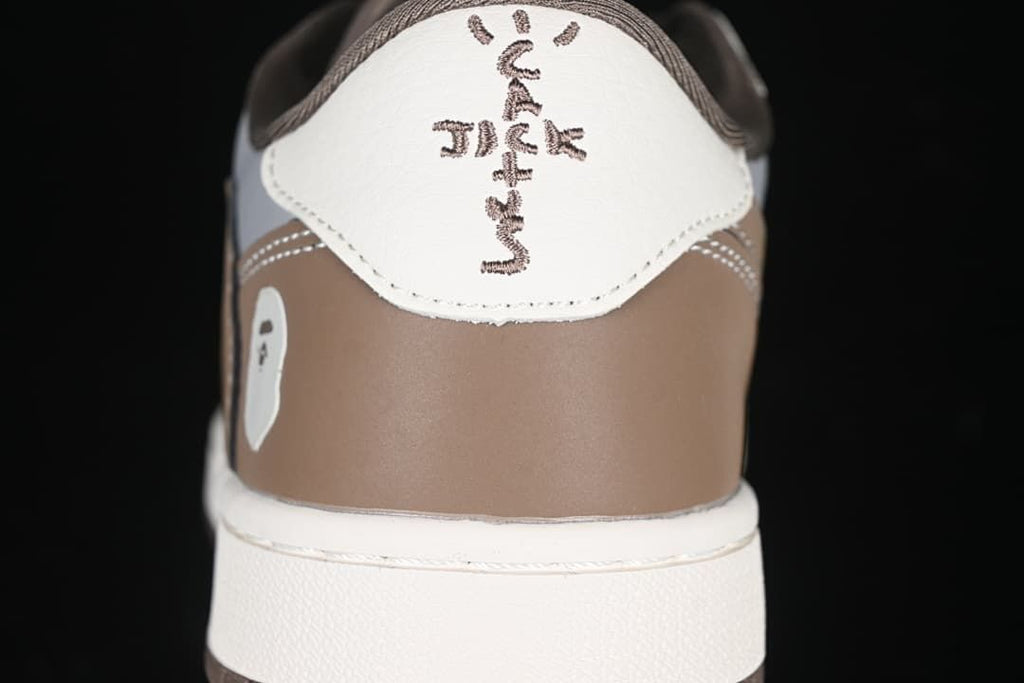 Rear view showing brown heel panels and embroidered heel details.