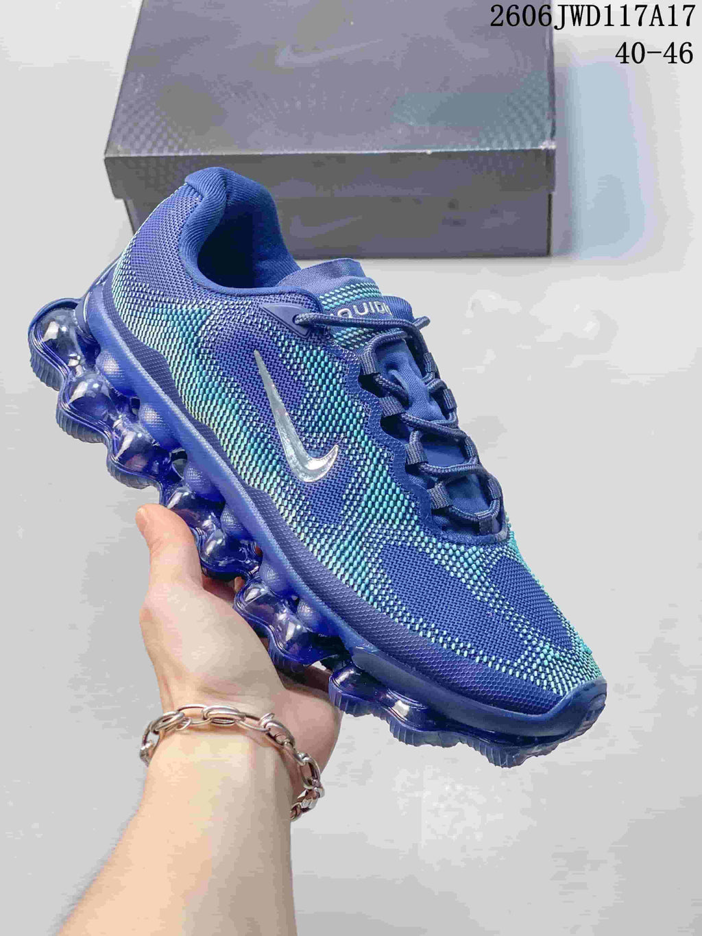 Dark gray and purple Nike Air Liquid Max sneaker with a patterned upper