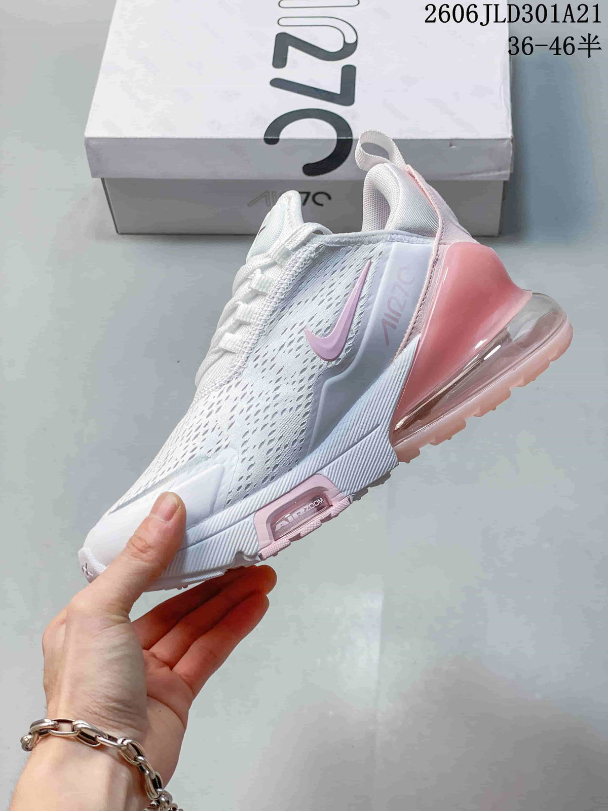 Side view of a white Nike Air Max 270 Premium sneaker with pink accents