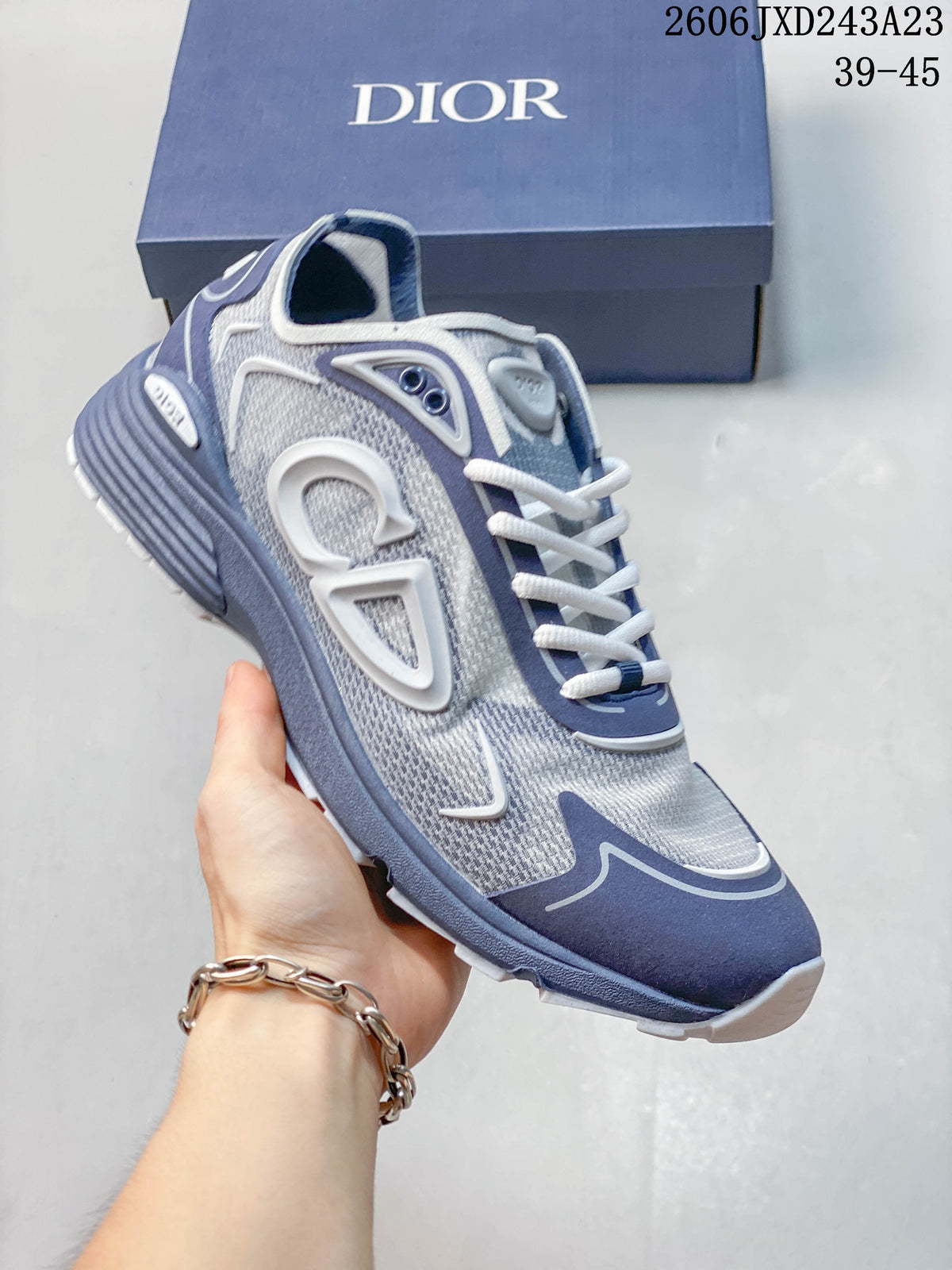 Angled close-up of the gray and blue low-top sneaker