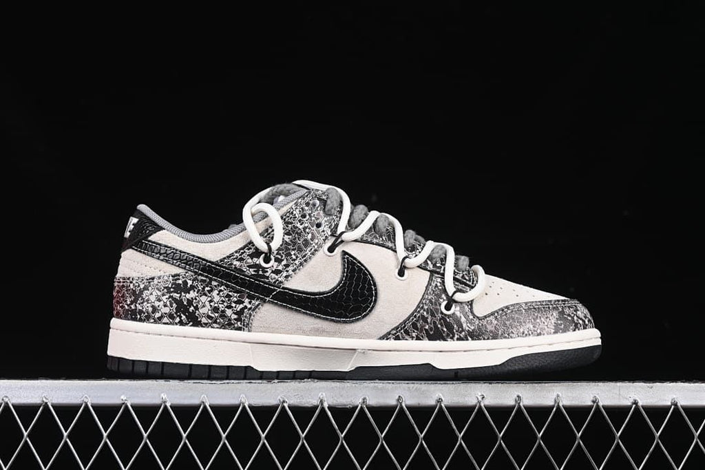 Side profile of a low-top sneaker with patterned overlays and a black Swoosh