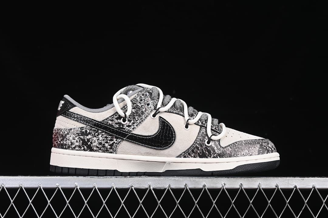 Side profile of a low-top sneaker with patterned overlays and a black Swoosh