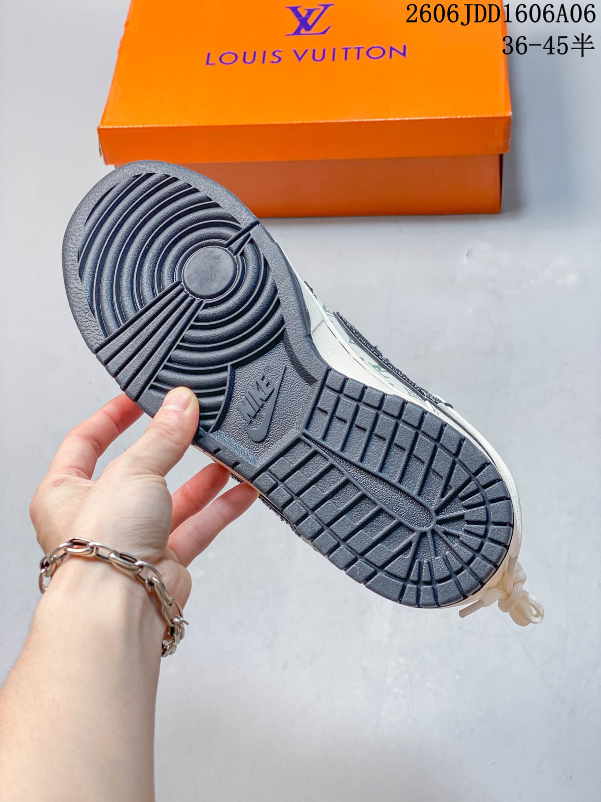 Close-up of the dark outsole and orange shoe box.