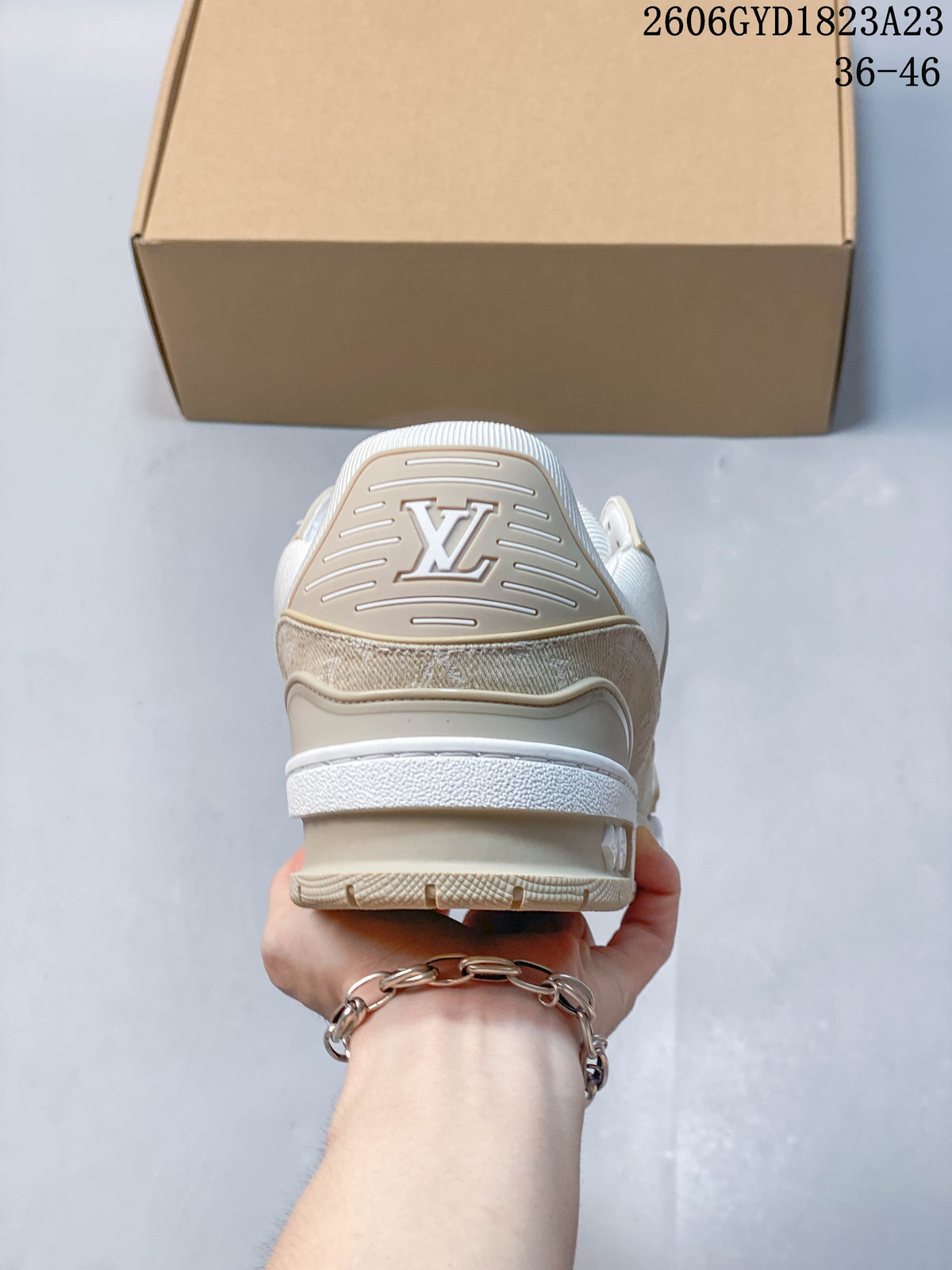 Rear view showing the heel detailing and outsole of a Trainer Low sneaker