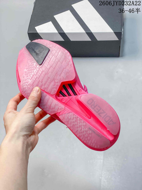 Pink running shoe outsole with patterned tread and a central cutout.