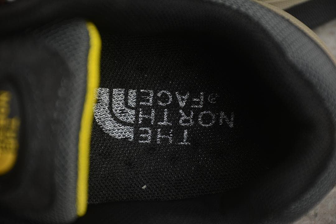 Close-up of the shoe's black padded interior with The North Face logo.