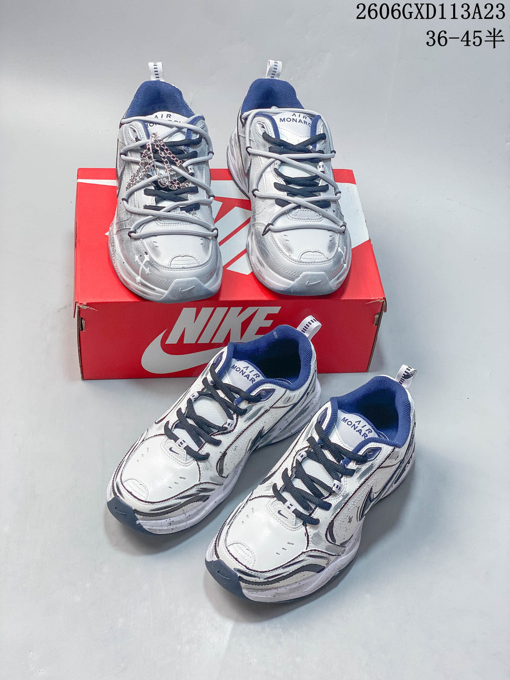 Multiple views of silver and white Nike Air Monarch sneakers with navy accents