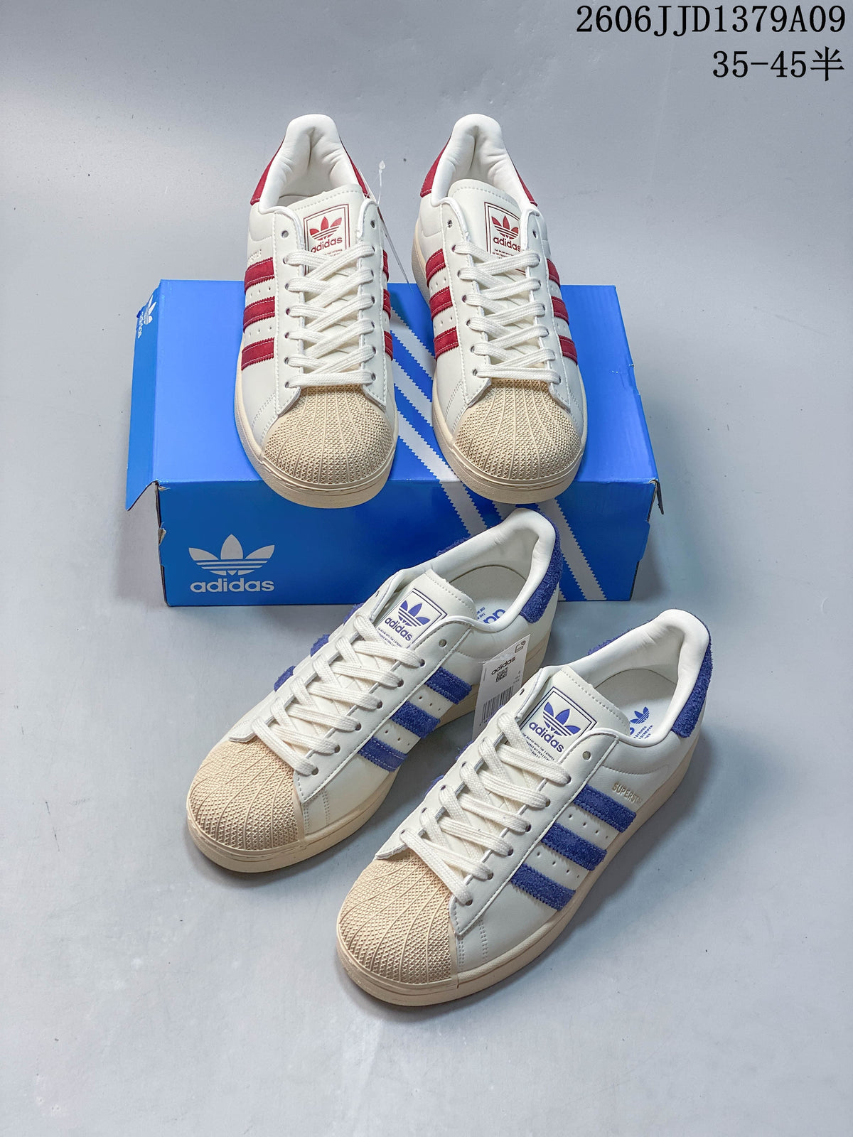 Cream adidas Superstar sneakers shown in red-accent and blue-accent versions.