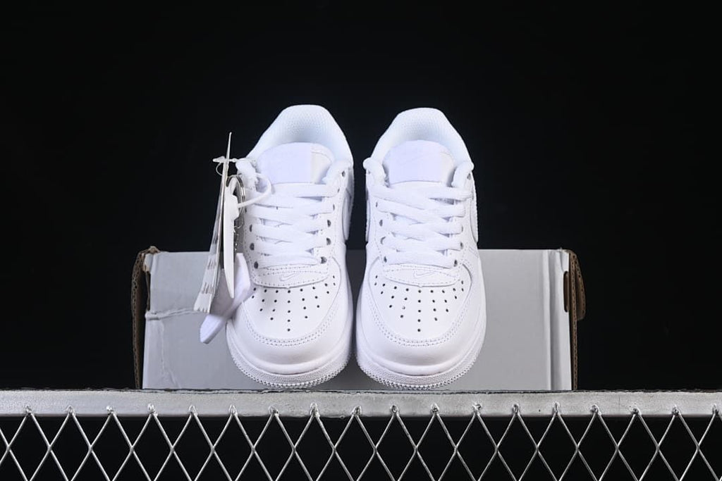 Front view of the white sneaker pair arranged on a box