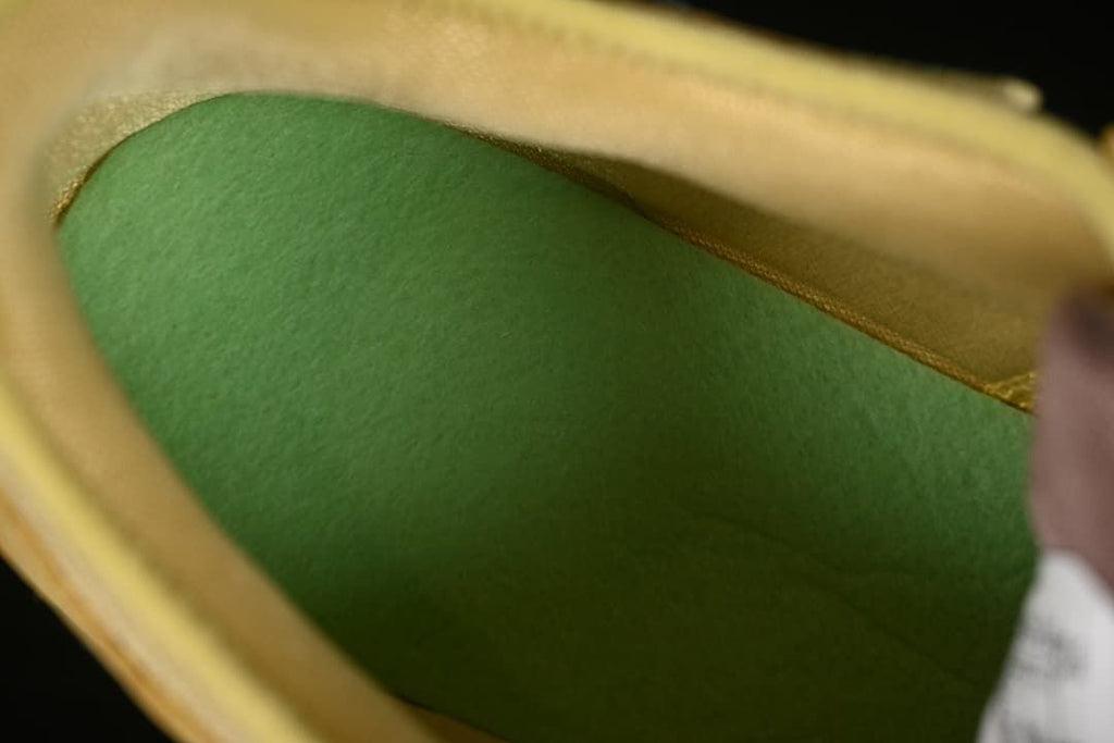 Close-up inside the shoe showing a green footbed.