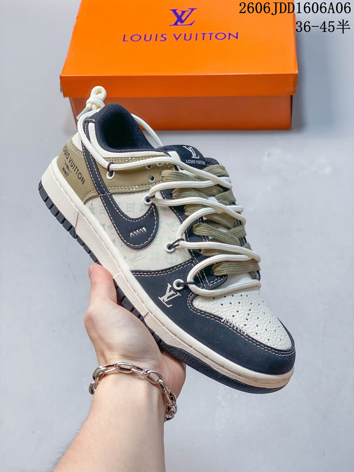 Cream, navy, and olive low-top sneaker with patterned side panels and layered laces.