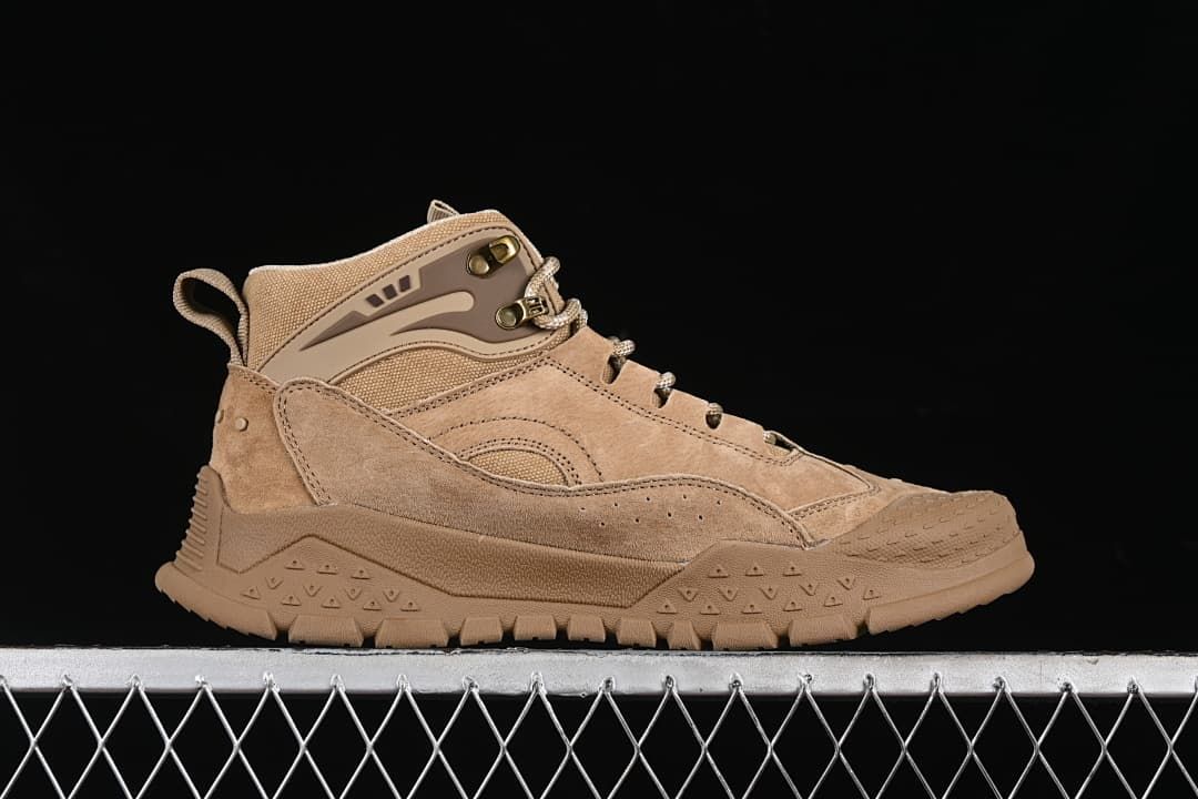 Side profile showing the mid-top upper, lace hooks, and rugged outsole.