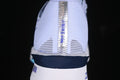 Rear view showing the heel construction and central reflective-looking strip.