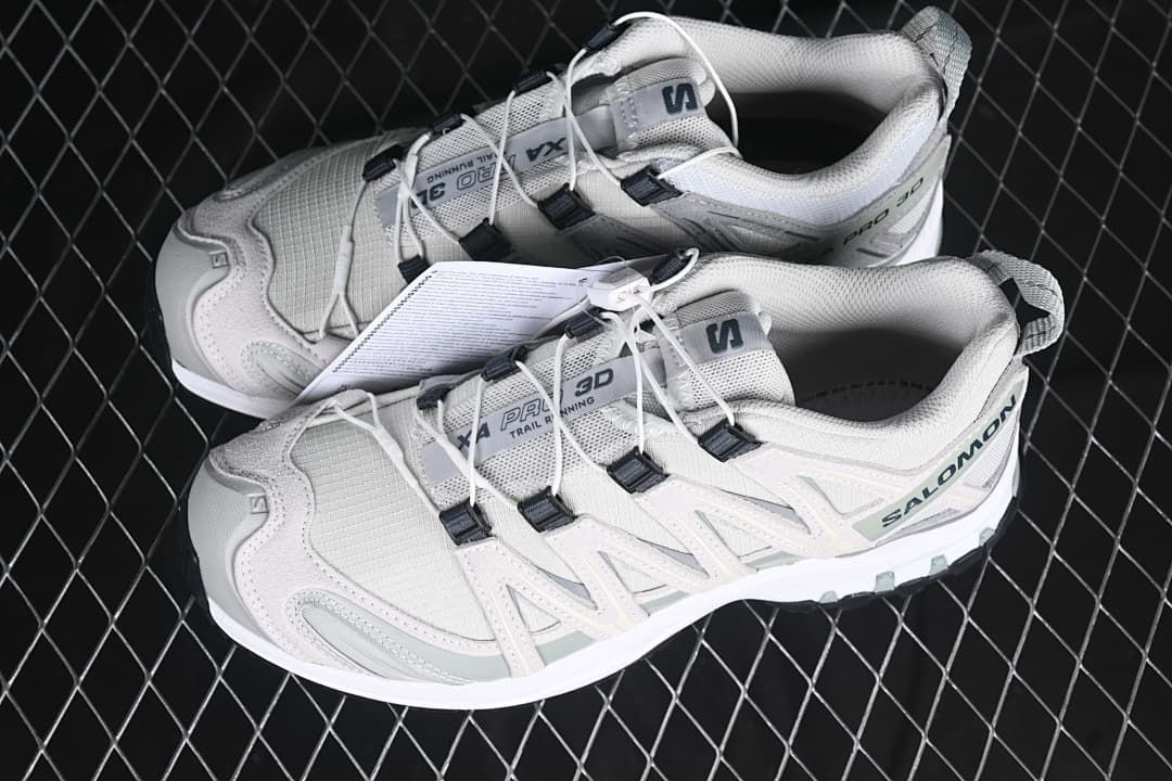 Pair of white and grey XA Pro 3D shoes shown from above and the side
