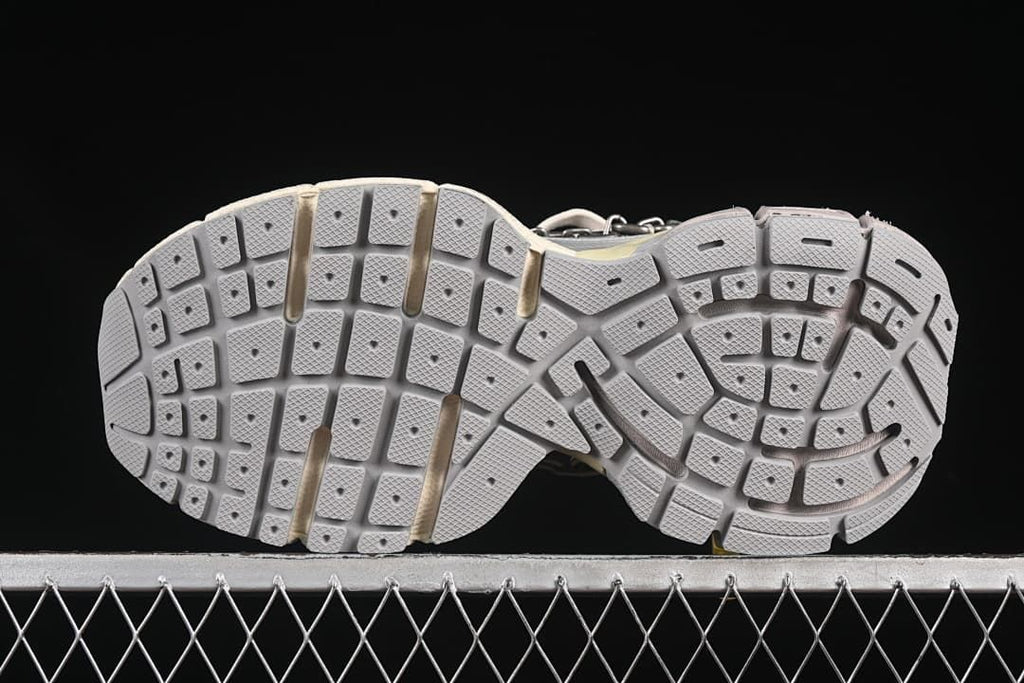 Underside view showing the segmented tread pattern.