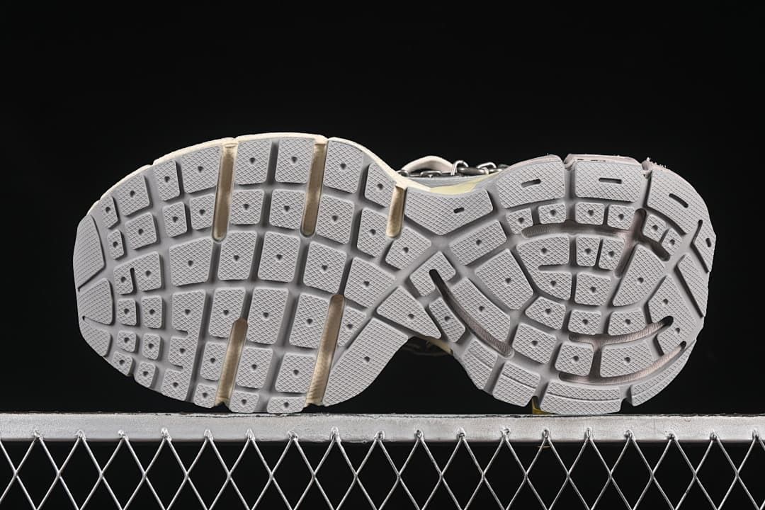 Underside view showing the segmented tread pattern.
