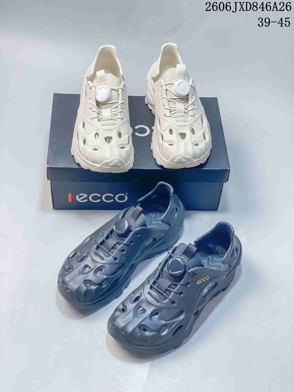Off-white and dark gray perforated clog-style sandals shown together.