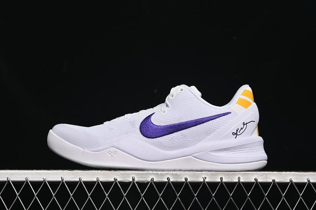 Side view of white Nike Kobe VIII Protro shoes with purple Swoosh and yellow heel accents