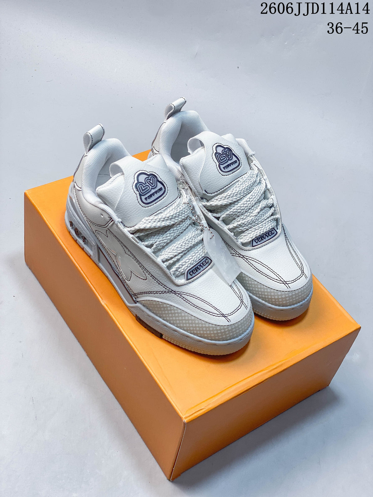 Pair of white and gray Louis Vuitton Trainer low-top sneakers viewed from the front on an orange box.
