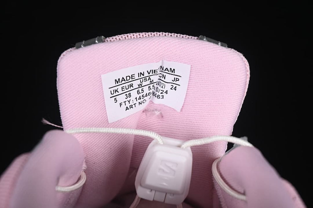 Pink sneaker tongue with size label showing EU 38