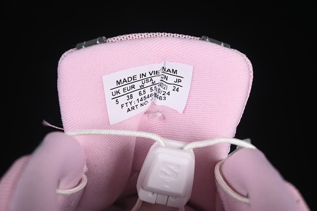 Pink sneaker tongue with size label showing EU 38