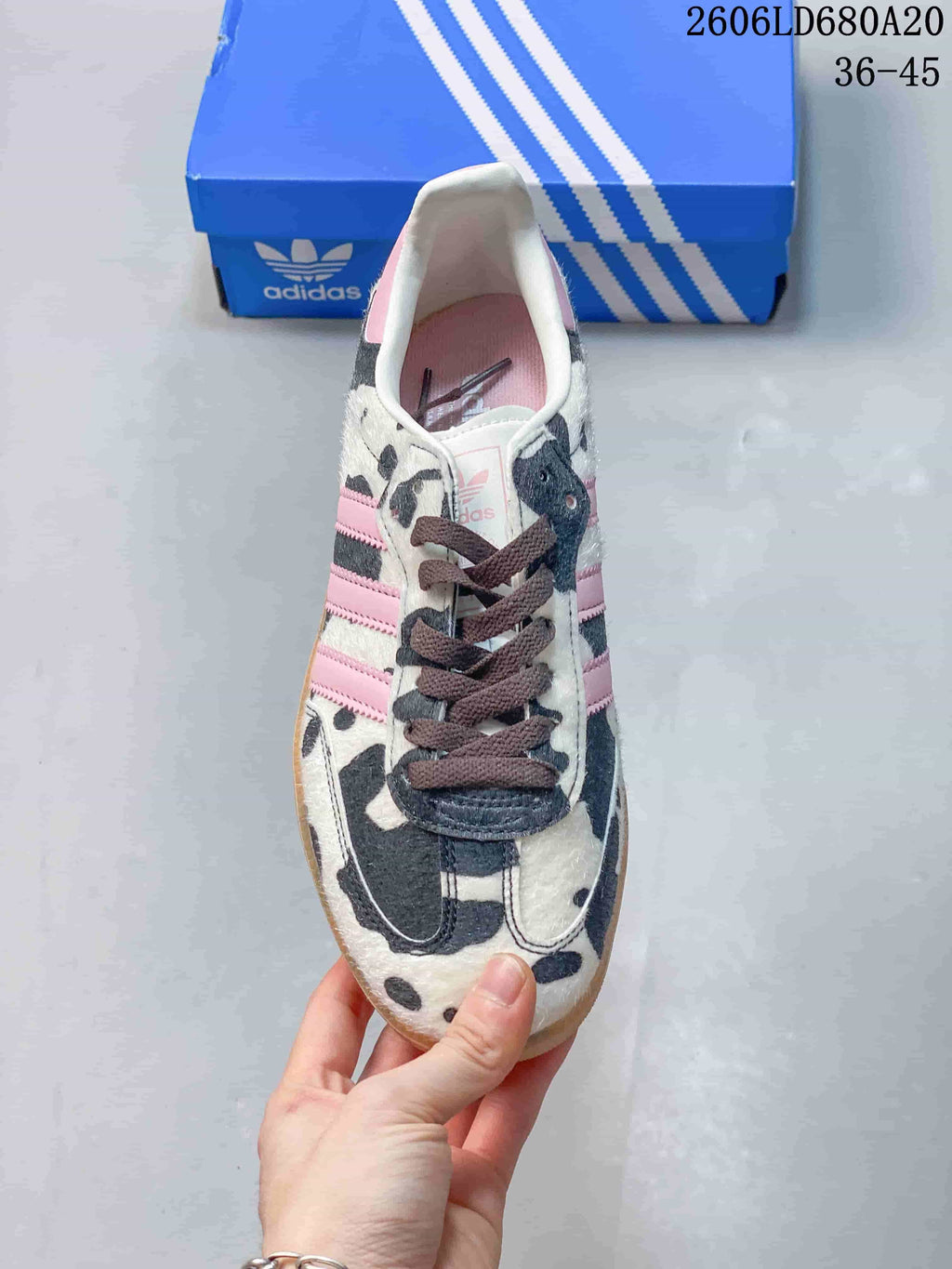 Top view of the Adidas Samba OG sneaker showing its cow-print design and dark laces