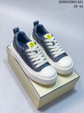 Pair of navy and white Fendi low-top lace-up sneakers viewed from above at an angle.