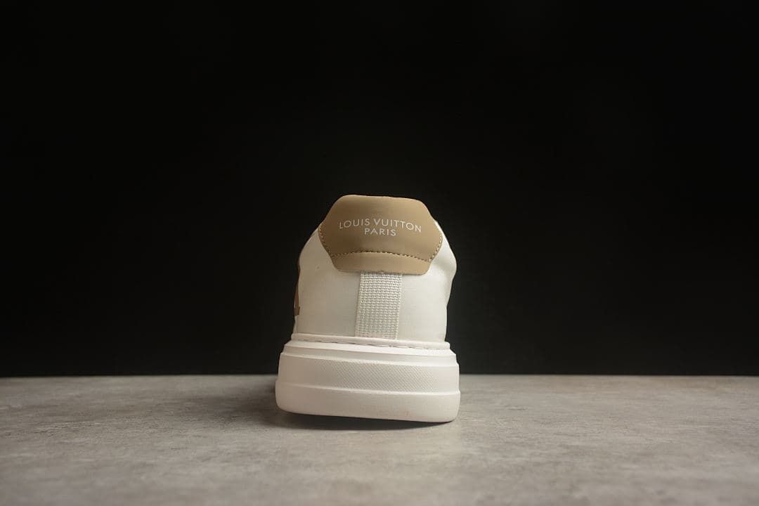 Rear view showing tan heel tab and heel branding