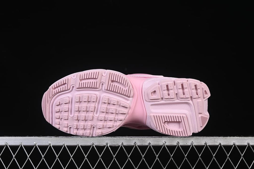 Underside view showing the patterned pink outsoles