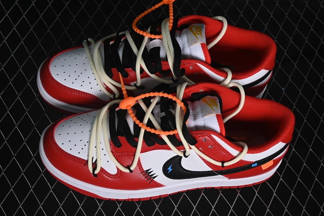 Pair of red, white, and black low-top sneakers viewed from above