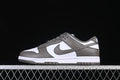 Side view of grey and white Nike SB Dunk Low sneakers