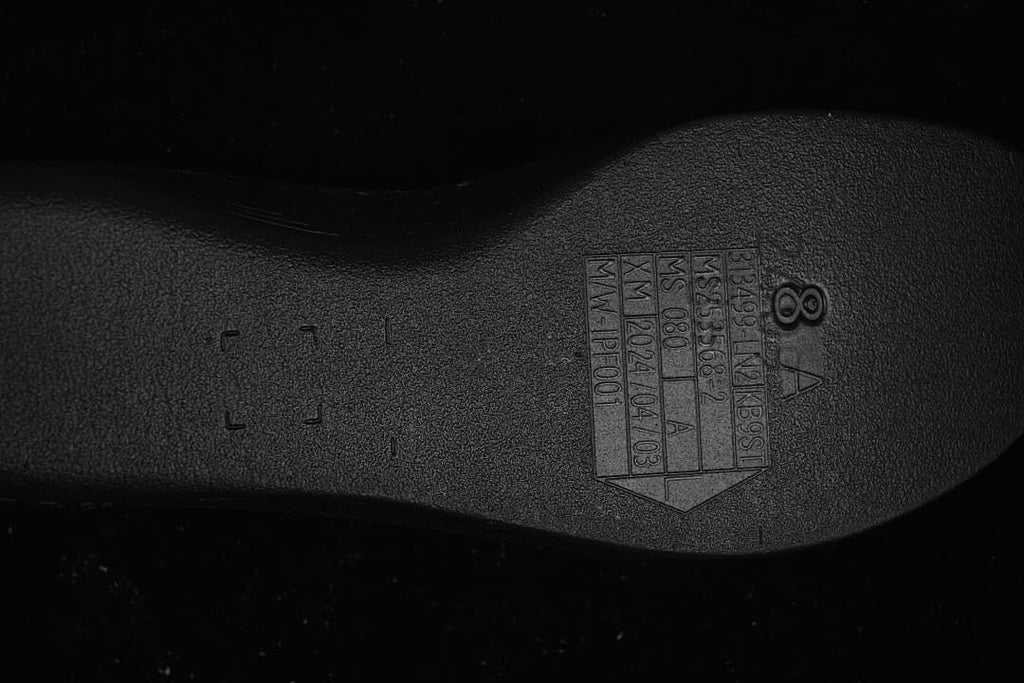 Close-up of molded markings on the shoe outsole