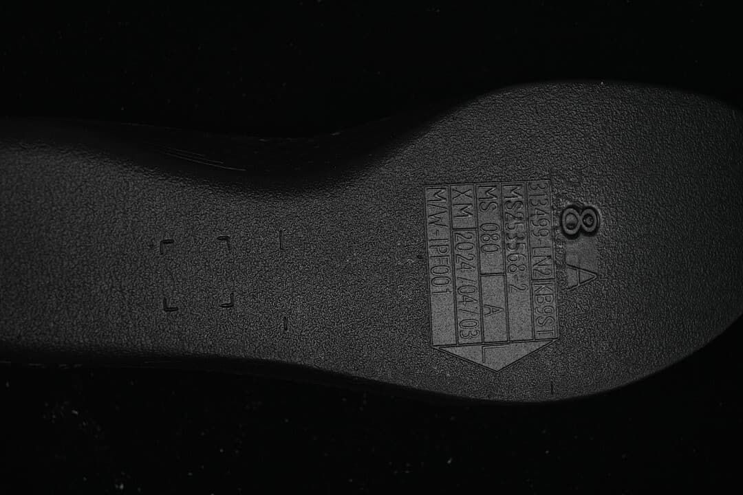Close-up of molded markings on the shoe outsole