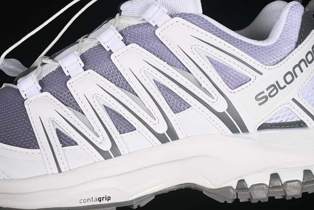 Close-up of the side structure, upper panels, and contagrip midsole marking