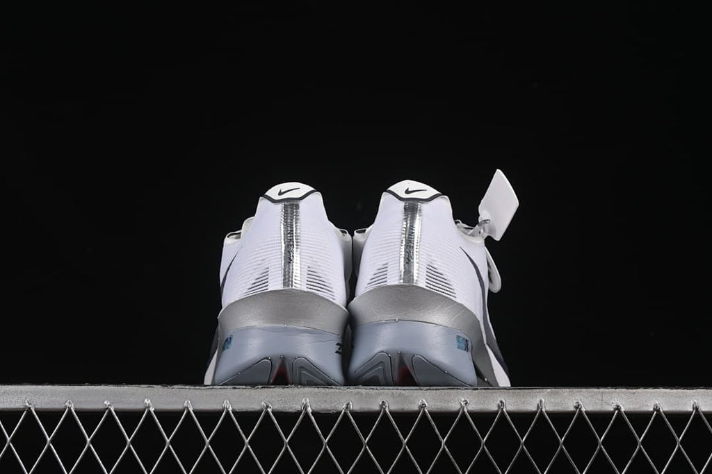 Rear view of both shoes showing the heel details and sculpted soles.