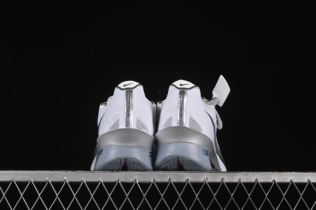 Rear view of both shoes showing the heel details and sculpted soles.