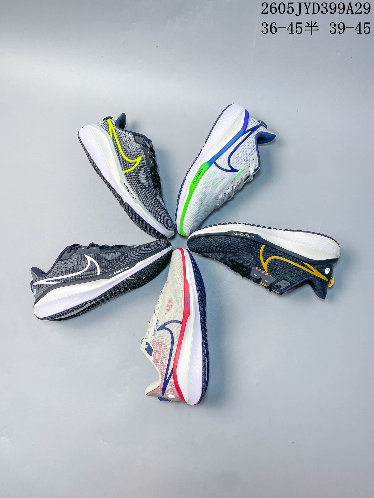Five Nike Air Zoom Vomero 17 running shoes in different color variations arranged in a circle.