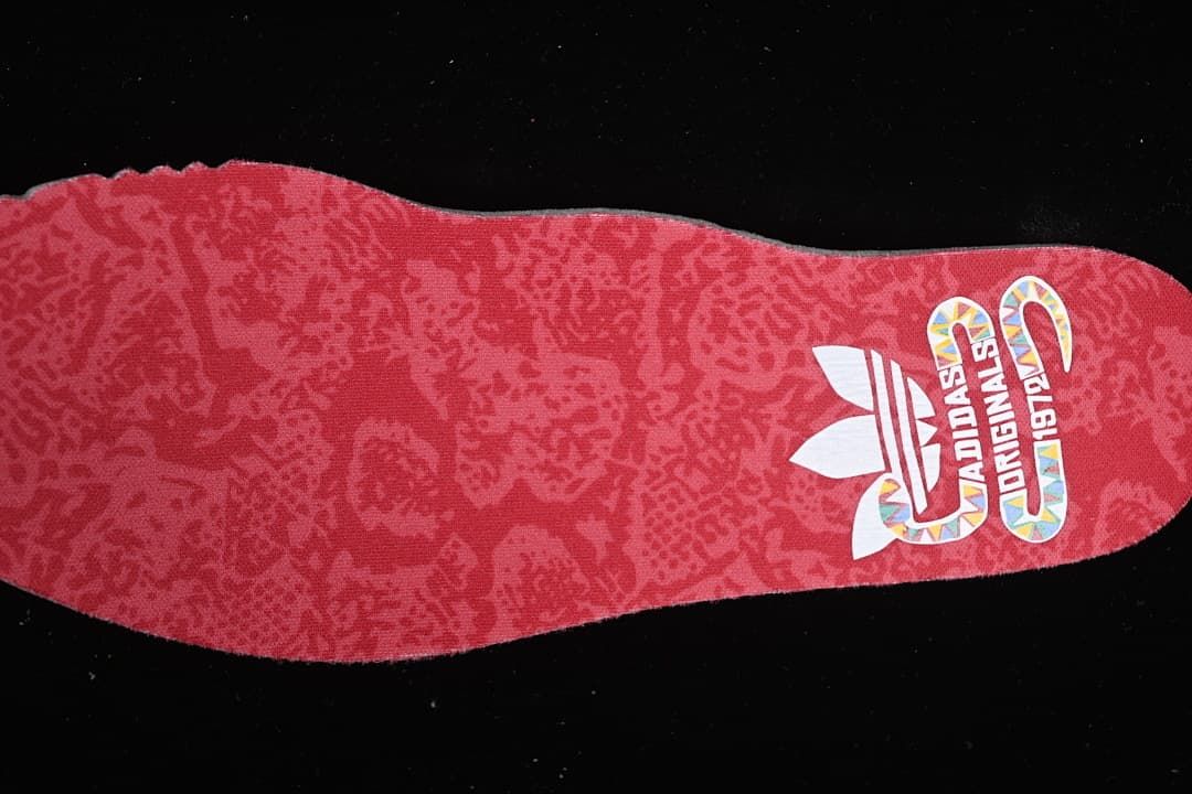 Red patterned insole with adidas Originals branding