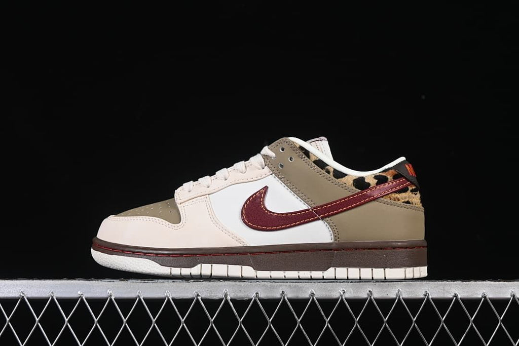 Side view of low-top sneakers in sail, olive and burgundy with leopard-print heel accents