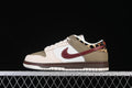 Side view of low-top sneakers in sail, olive and burgundy with leopard-print heel accents