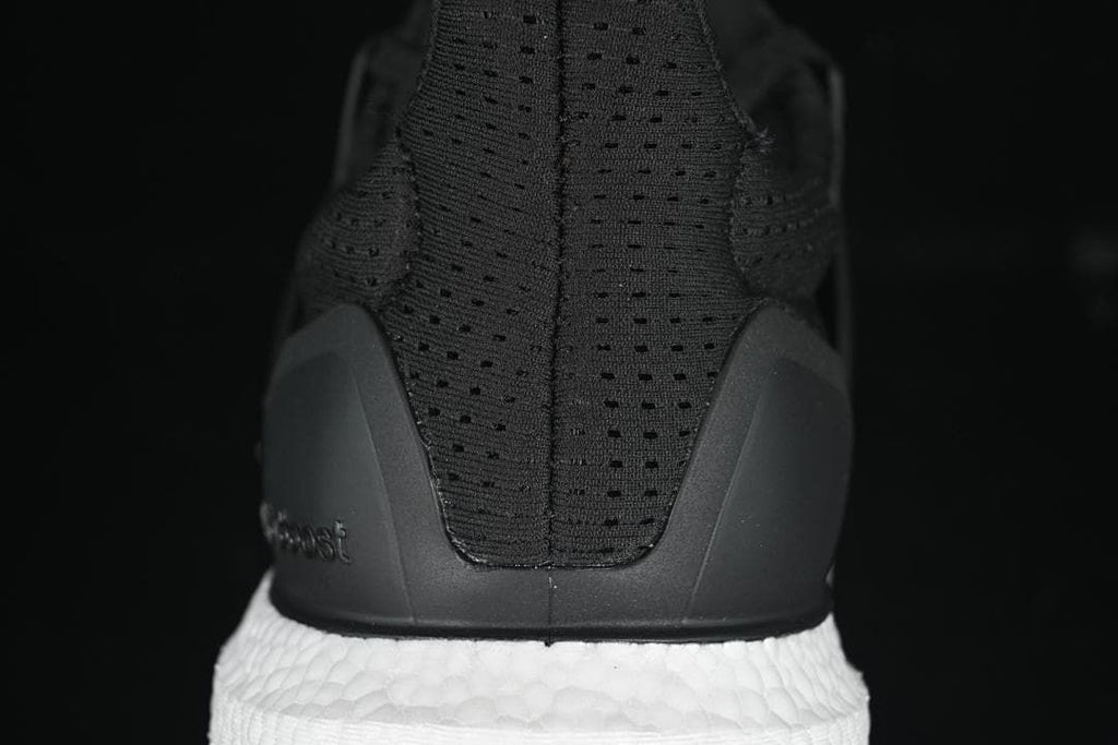 Rear view showing the knit heel and white midsole.