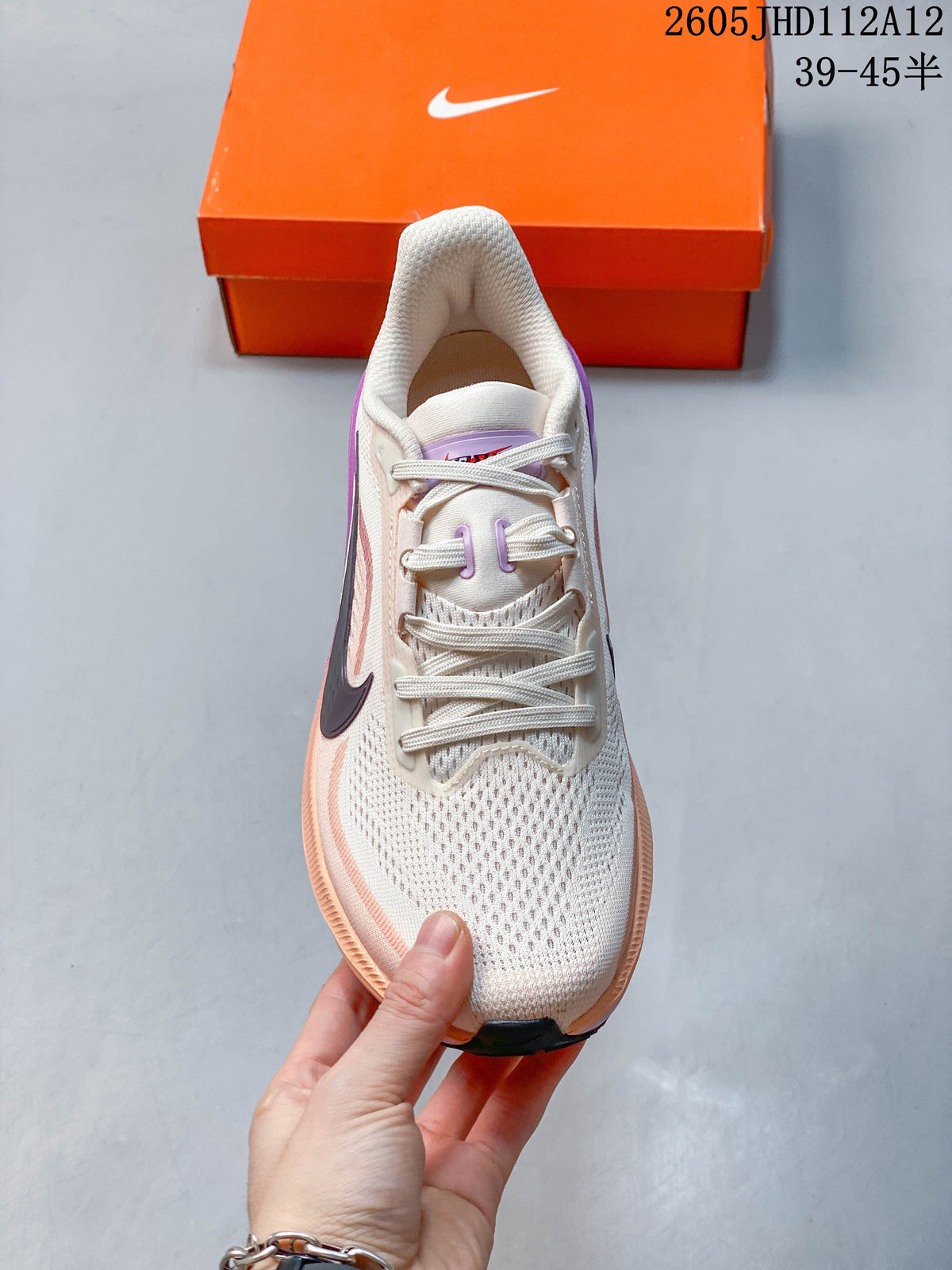 Front view of the shoe showing its lace-up fastening and cream-colored upper.