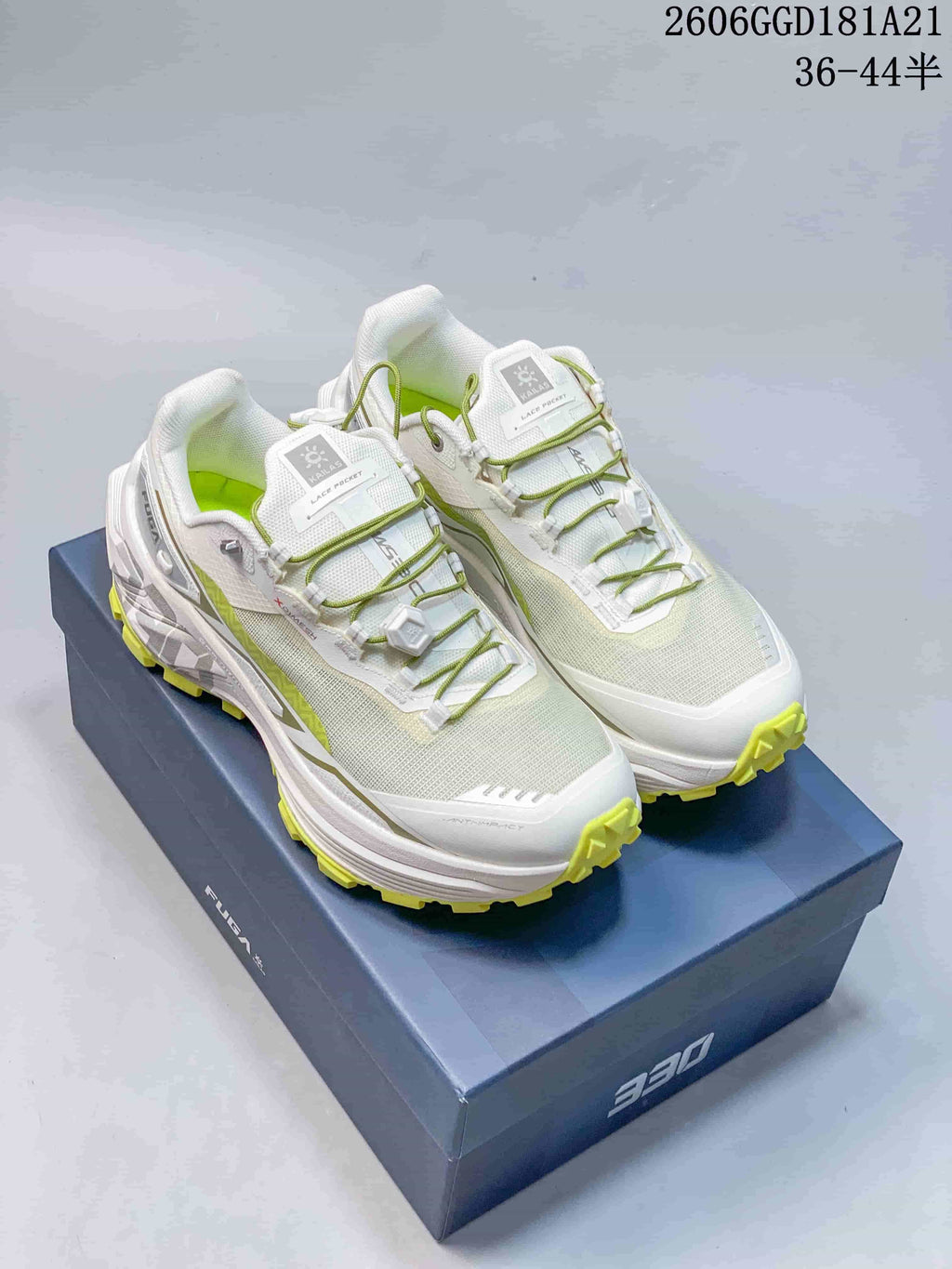 Pair of white and pale green Kailas FUGA EX BOA trail-running shoes with lime outsole accents